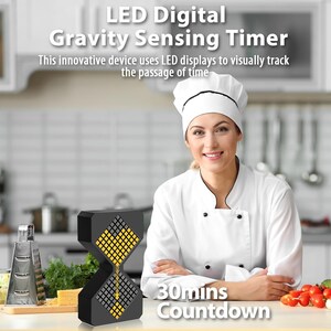 May include: A black LED digital gravity sensing timer with a yellow and gray display, shaped like an hourglass. The timer displays "30mins Countdown" and the text "This innovative device uses LED displays to visually track the passage of time."