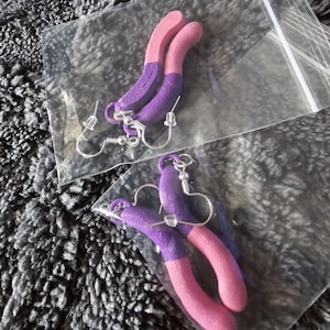 pink and purple gummy worm earrings