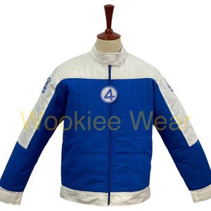 May include: Blue and white jacket with a full-length zipper. The jacket has a white collar and white accents on the shoulders and cuffs. A circular patch with the number 4 is on the chest. The sleeves have a patch with a number 4. The jacket is displayed on a mannequin.