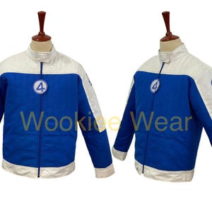 May include: Blue and white jacket with a zipper closure. The jacket has a white upper section and sleeves, with blue on the lower body. A circular patch with the number 4 is on the chest. The text "Wookiee Wear" is visible.