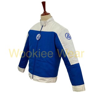 May include: Blue and white jacket with a zipper closure and the number 4 logo on the chest and sleeve. The jacket has a stand-up collar and white accents on the shoulders and sleeves. The jacket is displayed on a mannequin.