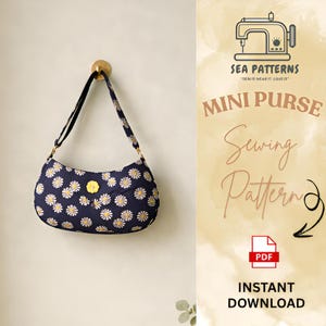 May include: A white ceramic mug with a black handle and the text "But First, Coffee" in a black, handwritten-style font. The mug is on a white surface.