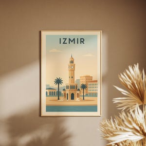 May include: A framed art print featuring a stylized illustration of Izmir, Turkey. The artwork depicts the Izmir Clock Tower, palm trees, and buildings, set against a blue sky. The word "IZMIR" is printed at the top of the image.