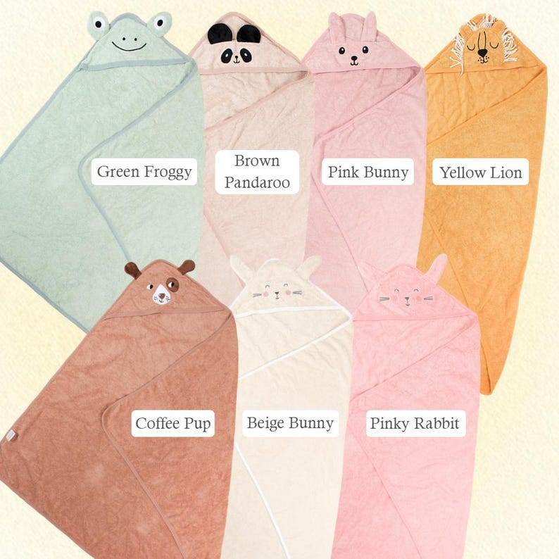 Puede incluir: Una colecci&oacute;n de toallas con capucha para beb&eacute;s en varios colores, cada una dise&ntilde;ada con una cara de animal en la capucha. Las toallas incluyen una rana verde, un panda marr&oacute;n, un conejito rosa, un le&oacute;n amarillo, un cachorro marr&oacute;n, un conejito beige y un conejo rosa. Las toallas son suaves y afelpadas.