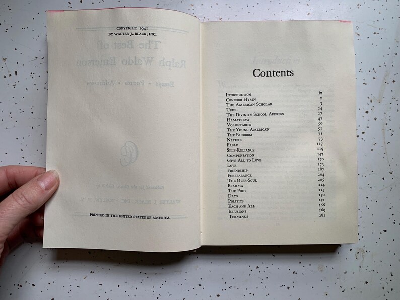 May include: Open book with the title "The Best of Ralph Waldo Emerson" and a contents page. The contents include "Introduction", "Concord Hymn", and "The American Scholar". Printed in the United States of America.