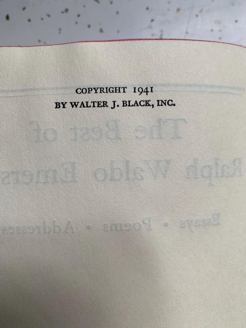 May include: Open book page with text reading "COPYRIGHT 1941 BY WALTER J. BLACK, INC." The page is off-white with a red edge. The title "The Best of Ralph Waldo Emerson" is partially visible.