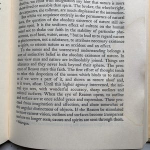 May include: Open book pages with printed text. The text is in black font on aged, off-white paper. The book's spine is visible on the right side, with a tan cover. The text discusses nature and reason.