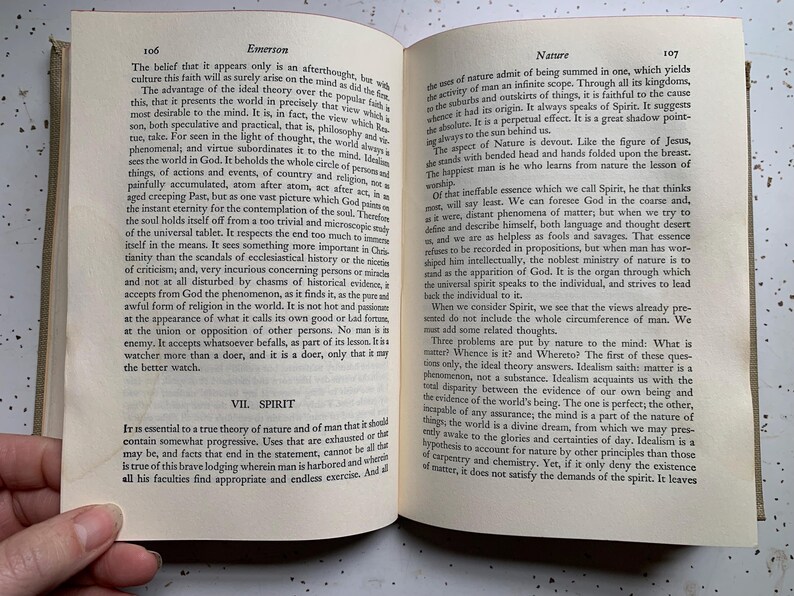 May include: Open book with text on pages 106 and 107, titled "Emerson" and "Nature." The pages are aged with visible wear. The book is open to a double-page spread, with text in black font.