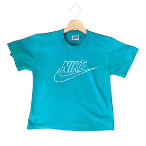 Vintage NIKE 1980&#39;s Made in USA Turquoise Blue Logo Tee, Boys Size 10-12 Medium