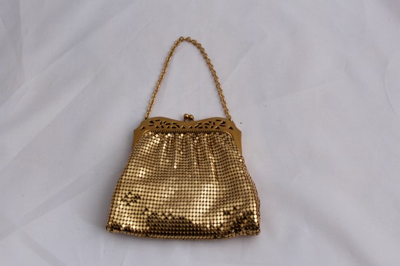 small gold bag with chain