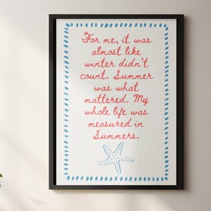 May include: Framed art print with a white background and a quote in red script: "For me, it was almost like winter didn't count. Summer was what mattered." A blue starfish and border complete the design.