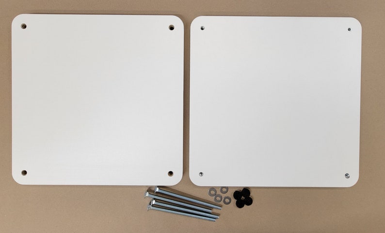 May include: Two white rectangular panels with four holes each, and four silver screws and four silver washers, and one black plastic washer.