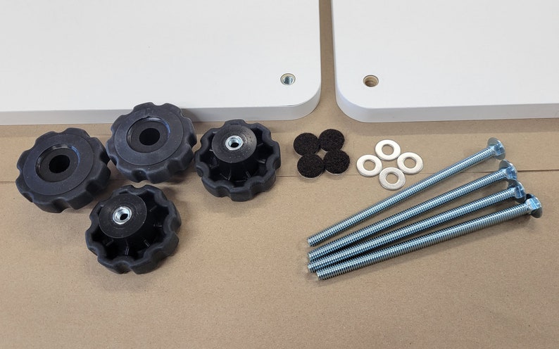 May include: A set of four black knobs, four silver washers, four black felt pads, and four silver screws with a silver head. The screws are approximately 6 inches long.