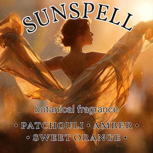 May include: An artistic image featuring a woman with flowing fabric, bathed in warm sunlight. The word "SUNSPELL" is at the top, with "botanical fragrance" and scent notes: patchouli, amber, and sweet orange below. The overall aesthetic is soft and ethereal.