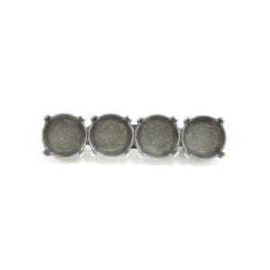 May include: A silver-toned metal jewelry finding with four round settings. Each setting has four prongs and a recessed area for stones or embellishments. The piece is designed to be a component in jewelry making.
