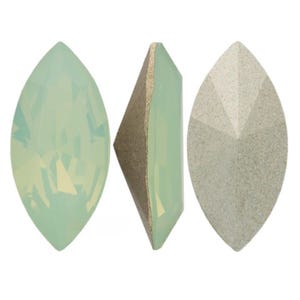 May include: Three marquise-shaped gemstones in varying shades of green and gray. The gemstones have a faceted design, with one showing a side view revealing a brown backing. The gemstones are likely for jewelry making.