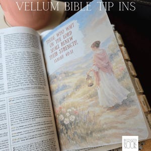 May include: A vellum Bible tip-in page featuring a watercolor-style illustration of a person in a white dress and pink shawl holding a lantern. The text reads: Those who wait on the Lord shall renew their strength. Isaiah 40:31. The page has tabs.