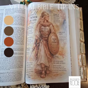 May include: A vellum Bible tip-in page featuring a watercolor illustration of a figure in armor with the text Put on the full armor of God. The image includes labels for the helmet of salvation, breastplate of righteousness, shield of faith, belt of truth, sword of the spirit, and feet fitted with the gospel of peace.