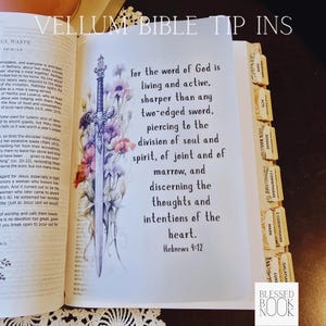 May include: A translucent vellum tip-in page inserted into a Bible, featuring a vertical illustration of a silver sword surrounded by colorful wildflowers. The text reads: For the word of God is living and active, sharper than any two-edged sword.