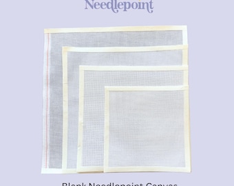 May include: Four square pieces of white Zweigart Mono Deluxe needlepoint canvas stacked in descending size order. Each piece features a cream-colored taped edge, and the largest canvas displays a single vertical red line along the left side.
