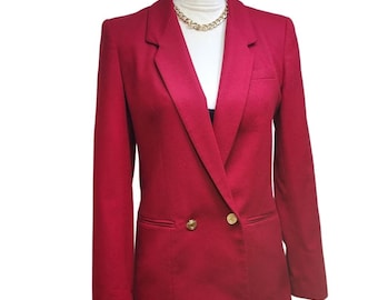 May include: A red double-breasted blazer with gold buttons. The blazer has a classic fit and a sharp lapel.