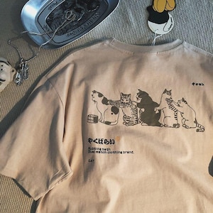 Japanse stijl frisse cartoon kattenprint T-shirt met korte mouwen, zomer mannen en vrouwen loszittende trend mode veelzijdig halflang