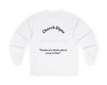 May include: White long-sleeved shirt with the text "Church Signs" in a black, curved font. Below the text are three small pink hearts connected by a thin pink line. The shirt also features the quote, "Faults are thick where Love is thin."