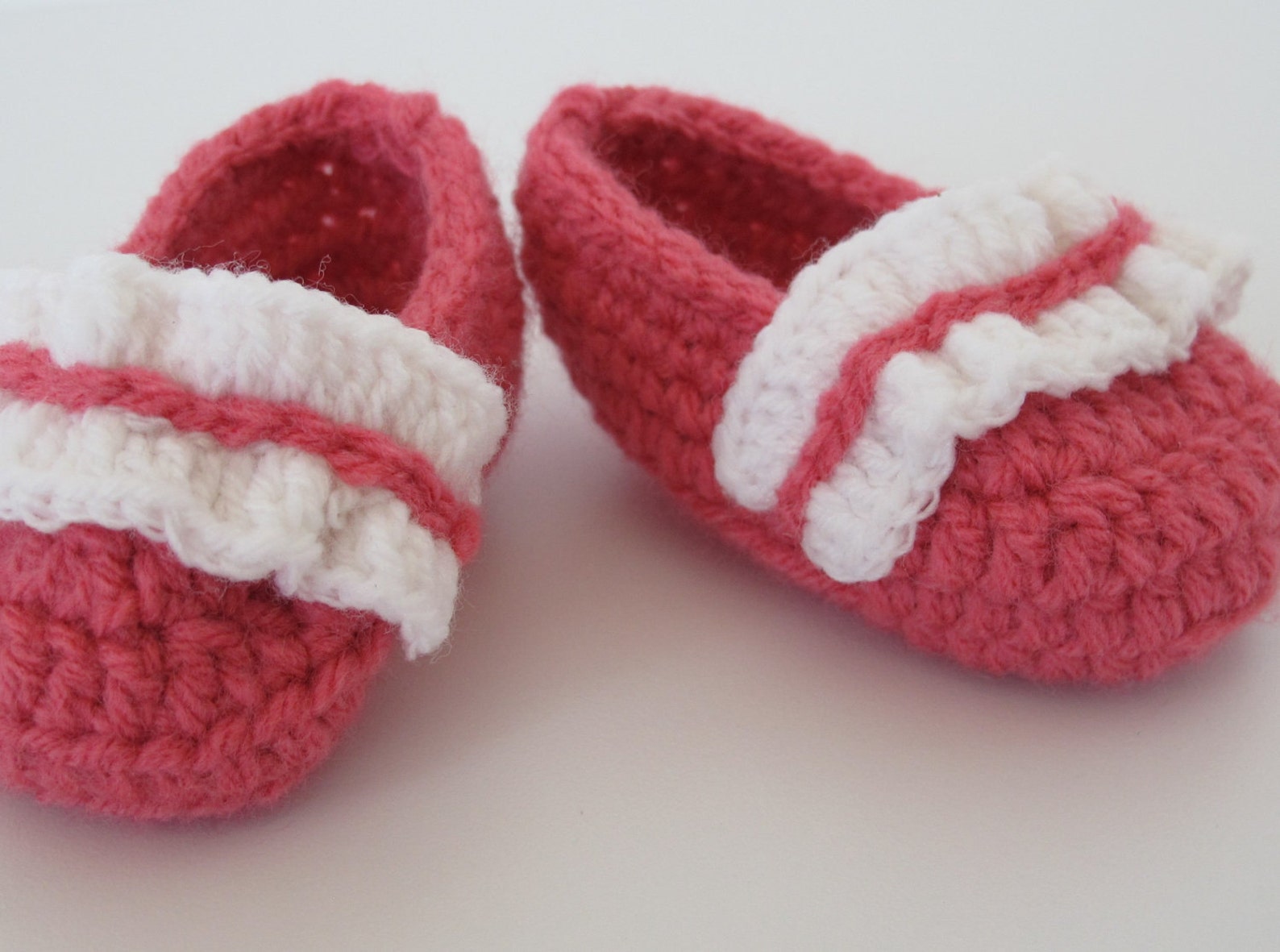 baby's first ballet shoes in bright coral with a white ruffle