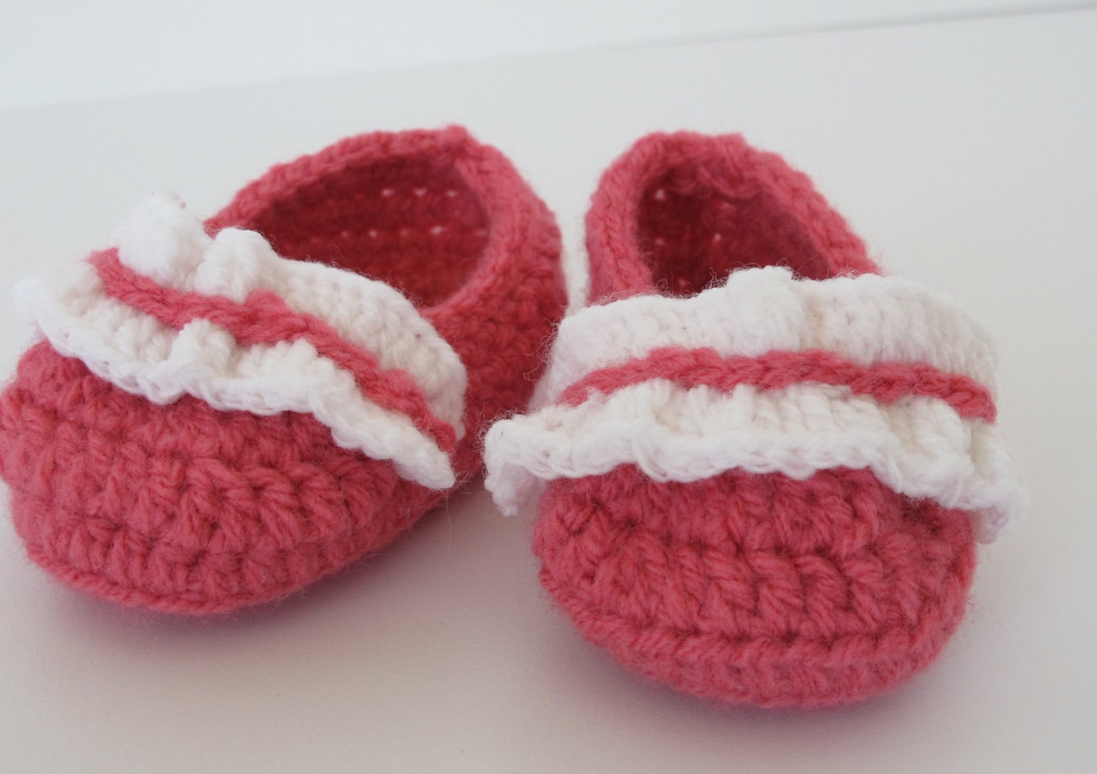 baby's first ballet shoes in bright coral with a white ruffle
