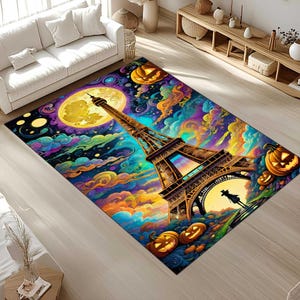 May include: A rectangular area rug featuring a vibrant, colorful illustration of the Eiffel Tower under a full moon, surrounded by pumpkins and swirling clouds. The rug has a Halloween theme with a whimsical design.