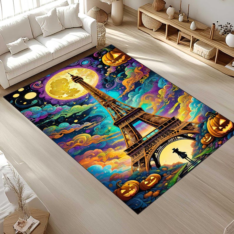 May include: A rectangular area rug featuring a vibrant, colorful illustration of the Eiffel Tower under a full moon, surrounded by pumpkins and swirling clouds. The rug has a Halloween theme with a whimsical design.