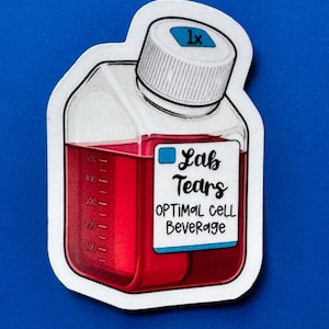 May include: A sticker featuring a cartoon illustration of a laboratory bottle filled with red liquid. The bottle has a white cap with the number "1x" on it. The label reads "Lab Tears OPTIMAL CELL Beverage". The sticker is outlined in white.