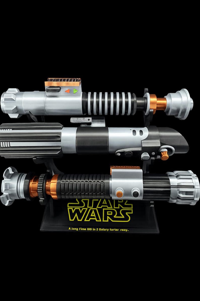 May include: Three Star Wars lightsabers are displayed on a black stand. The lightsabers have silver, black, and orange accents. The stand has the Star Wars logo and the text "A long time ago in a galaxy far, far away."