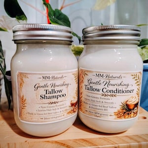 May include: Two clear glass jars with silver lids containing white cream. The left label reads MM-Naturals Gentle Nourishing Tallow Shampoo, 16oz (454 grams). The right label reads MM-Naturals Gentle Nourishing Tallow Conditioner, 16oz (454 grams).