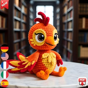 May include: A handmade crochet bird in shades of orange, yellow, and red, with large, expressive eyes. The bird is sitting on a white marble surface, with a blurred library background. The bird has a "NEW" tag in the upper left corner.