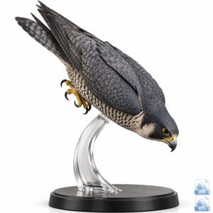 May include: A detailed figurine of a peregrine falcon in a high-speed diving posture. The bird features dark grey and black plumage on its back and wings, with white and black barred feathers on its underside, yellow talons, and a sharp beak.