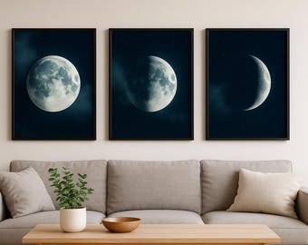 May include: Three framed art prints depicting the phases of the moon. Each print features a different phase of the moon against a dark blue background with subtle cloud and star details. The frames are black.