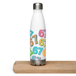 May include: A white insulated water bottle with a silver cap and base. The bottle is covered in a repeating pattern of colorful numbers, including orange, blue, green, and pink. The numbers are in a playful, handwritten style.