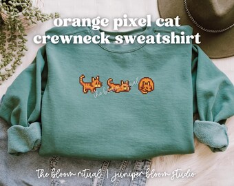 Pomarańczowa, przytulna bluza z okrągłym dekoltem i motywem kota pikselowego | przytulny prezent dla graczy