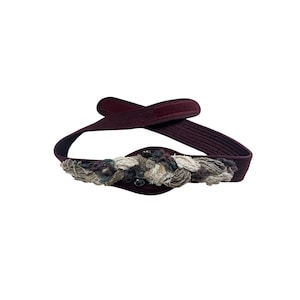 Vintage statement belt featuring wool knit multicolor braided detail.