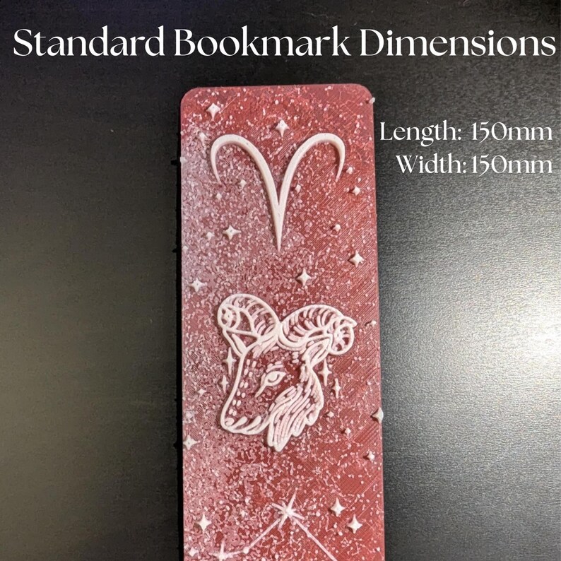 May include: A red bookmark with white Aries zodiac symbols and star accents. The bookmark is 150mm long and 150mm wide. The text "Standard Bookmark Dimensions" is at the top.