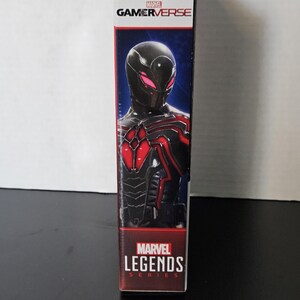 May include: A Marvel Gamerverse action figure box. The box shows a character in a black and red suit with a mask. The Marvel Gamerverse logo is at the top, and the Marvel Legends Series logo is at the bottom.