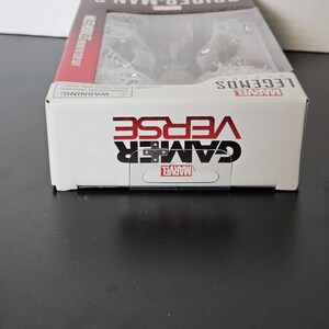 May include: A boxed Marvel Legends Gamerverse Spider-Man 2 action figure. The box is white with red accents and features the Marvel logo, the words "Gamerverse" and "Spider-Man 2". The figure is visible through a clear plastic window.