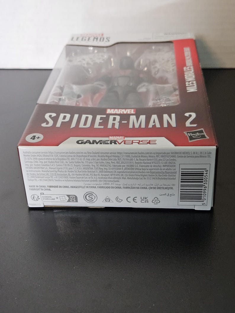 May include: A Marvel Legends Spider-Man 2 action figure in a clear plastic package. The box features the Marvel Gamerverse logo and the text "Miles Morales". The packaging is red and black.