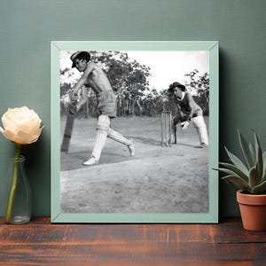 Cricket During Wartime A Historical Black and White Capture of Men Playing Shirtless in Nature&#39;s Arena