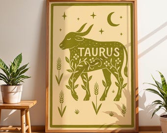 Puede incluir: Una impresión artística enmarcada con una ilustración verde de un toro, el signo zodiacal Tauro, sobre un fondo crema. La palabra "TAURUS" se muestra en el cuerpo del toro. La obra de arte incluye espigas de trigo, estrellas y una luna creciente.