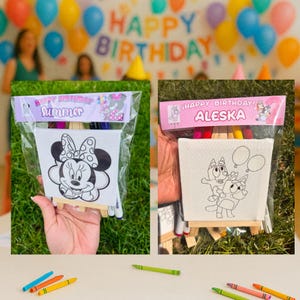May include: Two packaged birthday art kits. One features Minnie Mouse, the other features Bluey characters. Each kit includes a small canvas, markers, and a wooden easel. The top of each package reads "Happy Birthday".