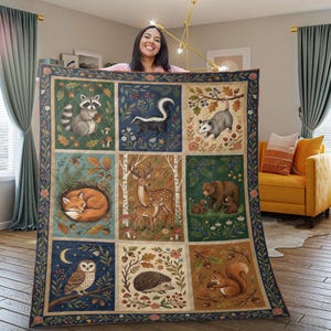 May include: A large, square quilt featuring nine illustrated panels of woodland animals, including a raccoon, skunk, fox, deer, bear, owl, hedgehog, and squirrel. The quilt has a dark blue border with floral and leaf patterns, and each animal panel is framed with a similar design.