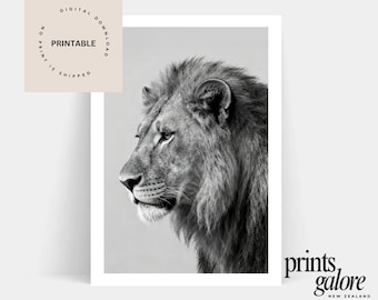 May include: Black and white print of a lion's profile. The image features the lion's head and mane in detail, with a focus on its facial features. The print is labeled "Printable" and "No Print is Shipped". The image is from "Prints Galore New Zealand".