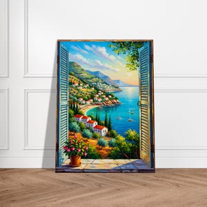 May include: A framed painting depicts a coastal village scene viewed through an open window with blue shutters. The artwork showcases a vibrant landscape with white buildings, red-tiled roofs, and a serene blue sea with boats. A potted plant with pink flowers sits on the window ledge.